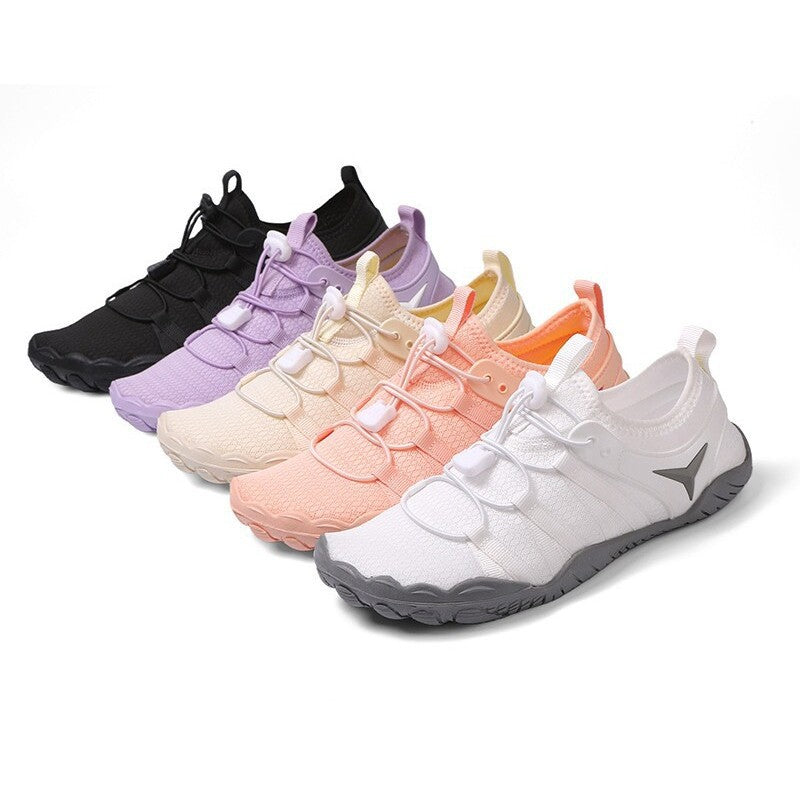 Row of colorful sneakers on a white background