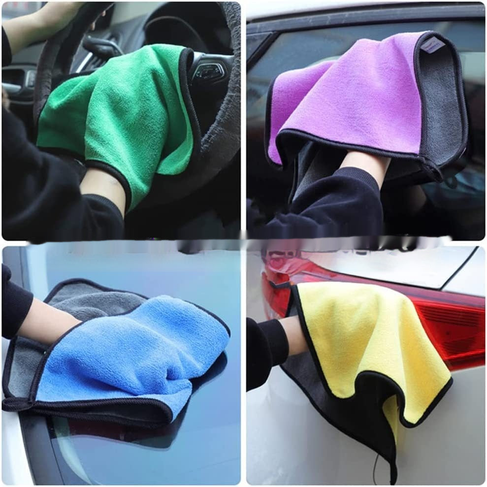 Four different colored microfiber cloths being used to clean a car.
