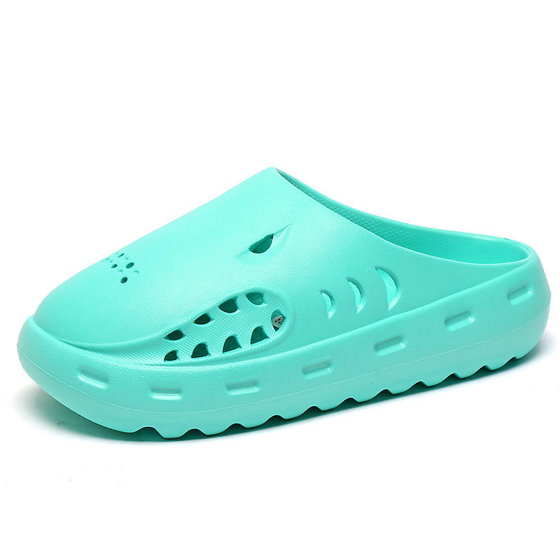 Turquoise clog shoe on a white background