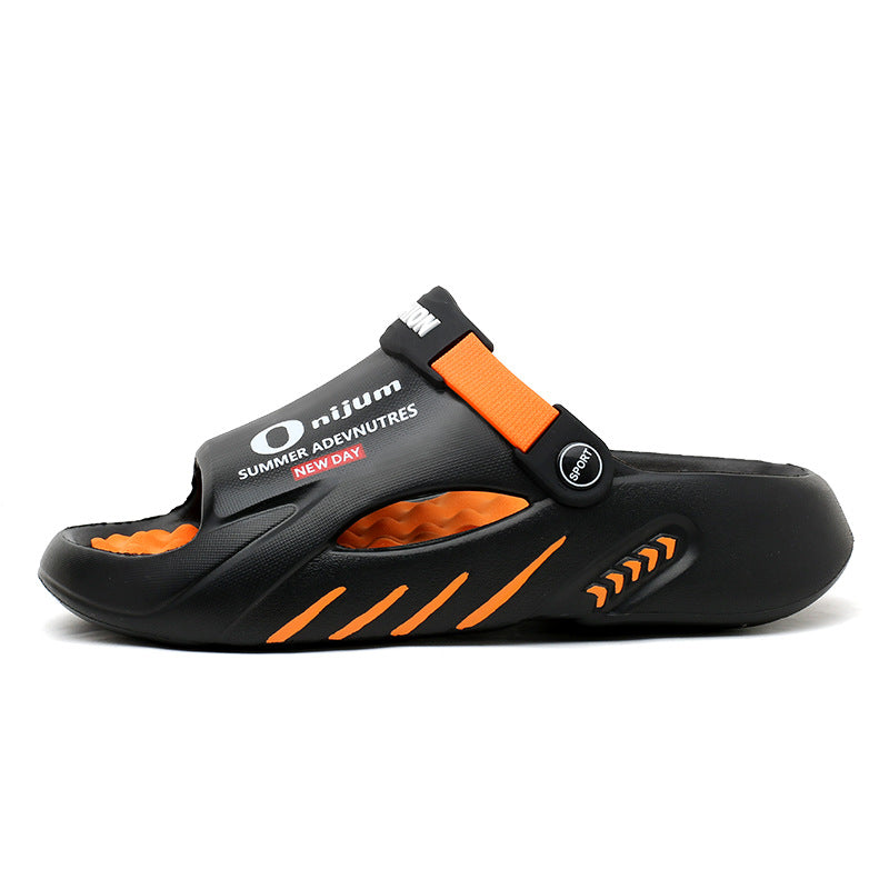 Black and orange sandal with visible branding on a white background