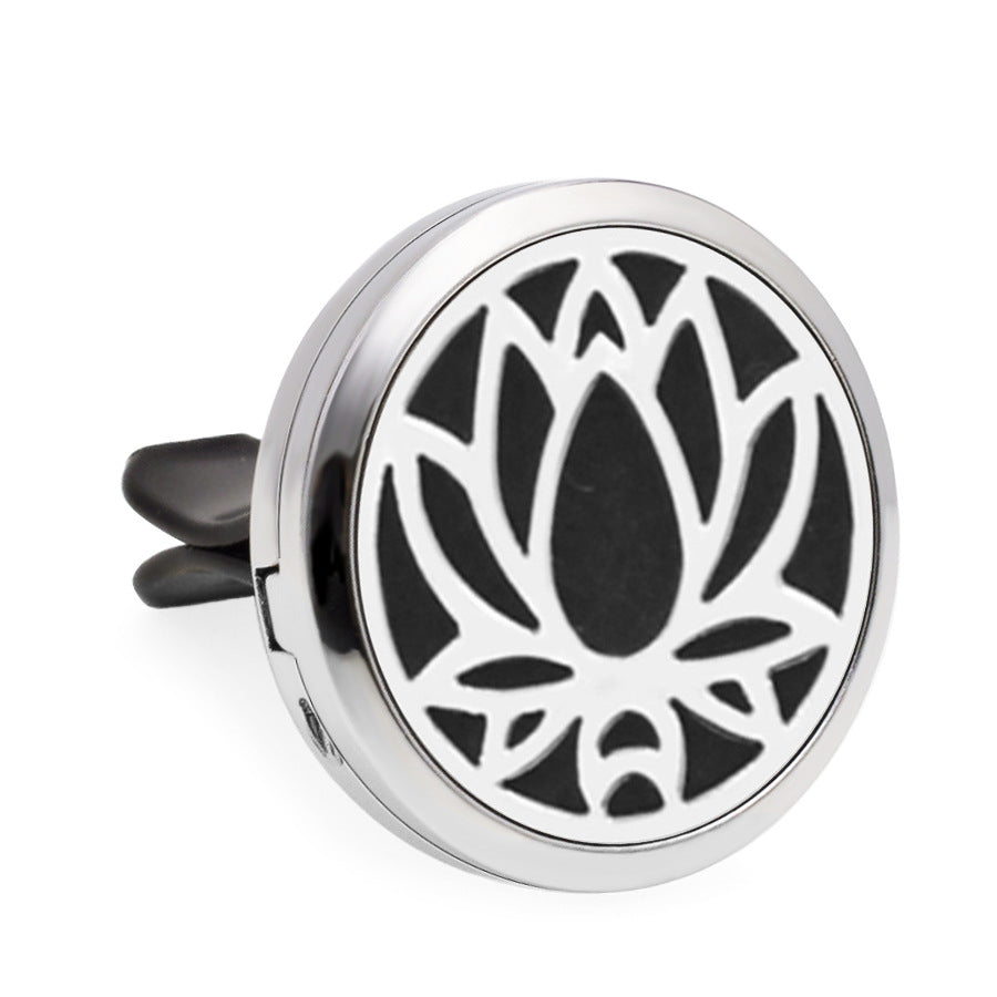 Round metallic diffuser with lotus flower design on a white background