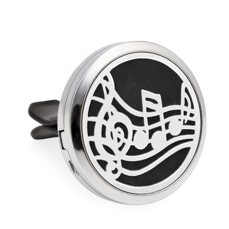Round metallic diffuser with music note design on a white background
