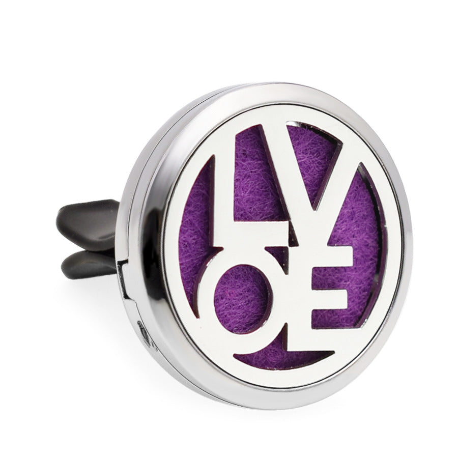 Round metallic diffuser with purple center and 'LOVE' engraving on a white background