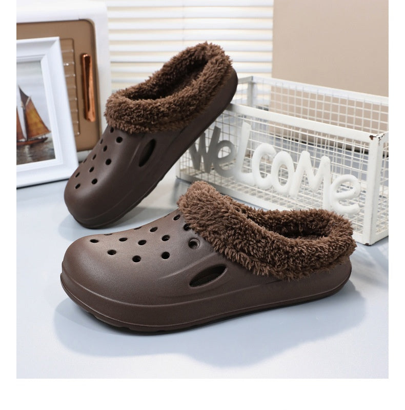 Brown slippers with fuzzy lining on a light surface.