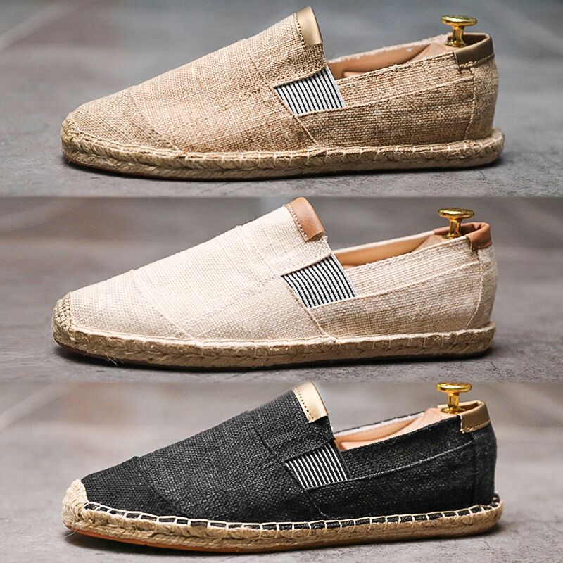 Two pairs of casual shoes, one beige and one black, on a gray background.