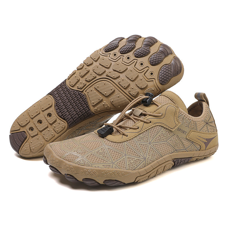 Pair of tan and brown hiking shoes on a white background