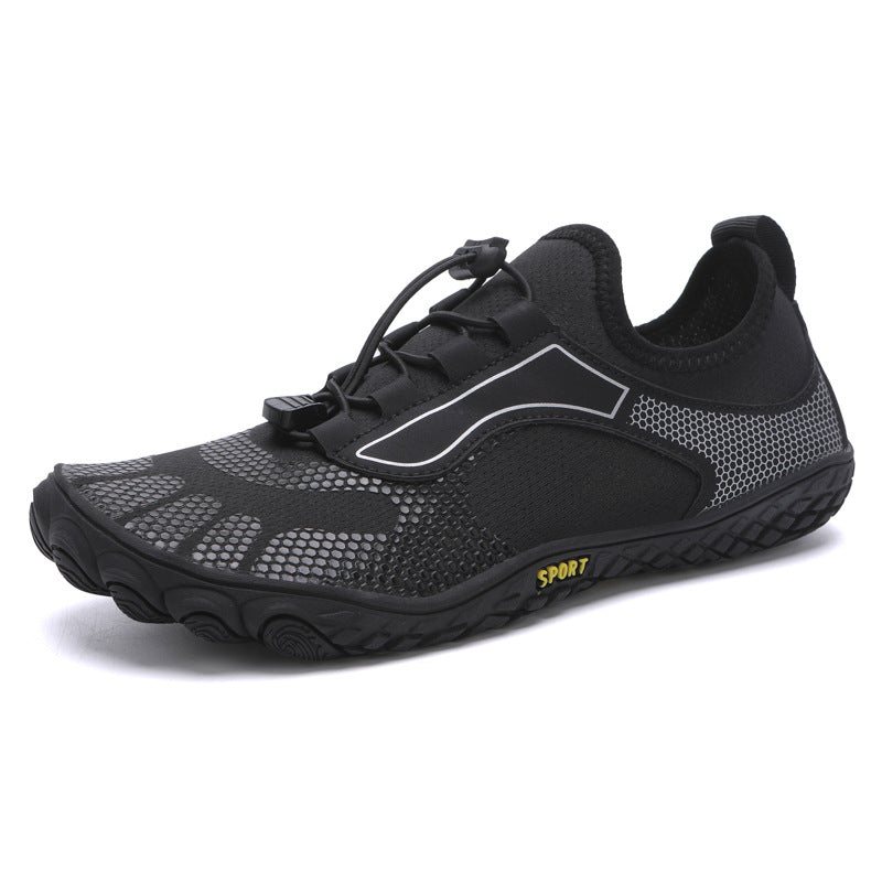 Black athletic shoe with gray accents on a white background