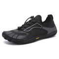 Black athletic shoe with gray accents on a white background