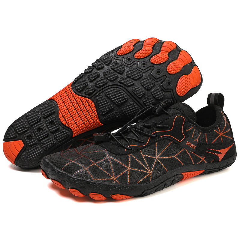 Black and orange athletic shoes on a white background
