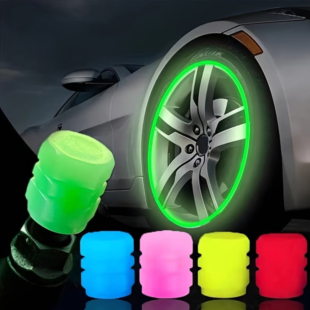 Car tire with glowing green rim and colorful wheel caps on a dark background
