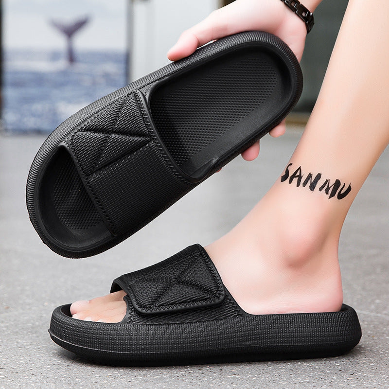 Black slides being worn with a blurred background