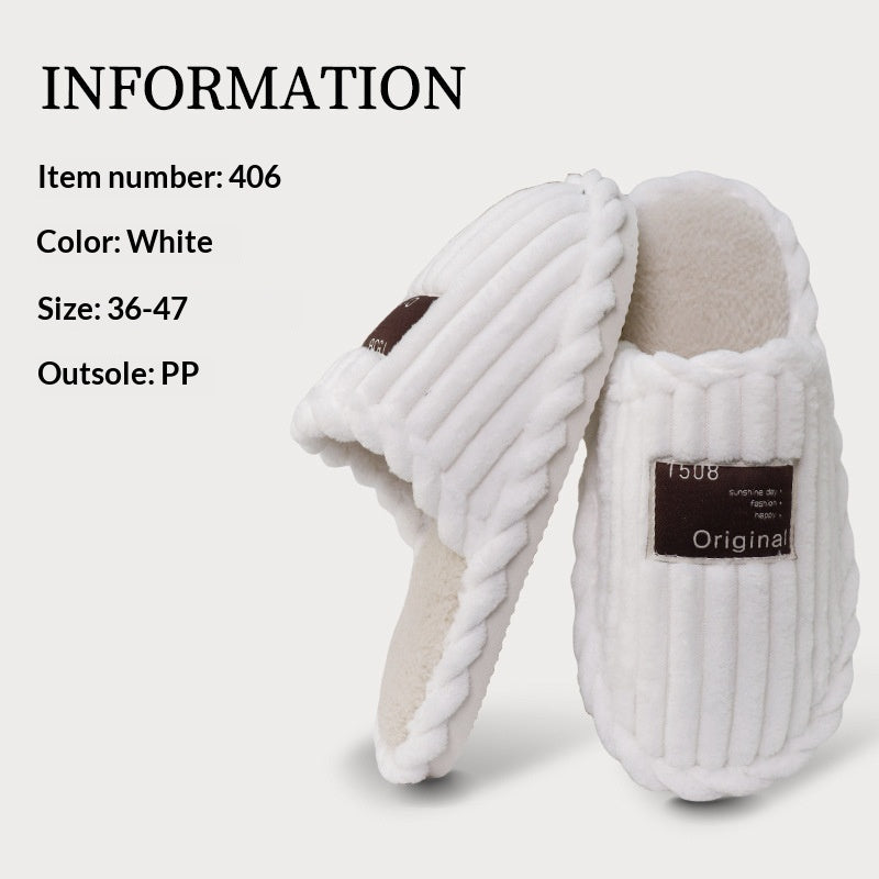 White slippers with a label on a light gray background