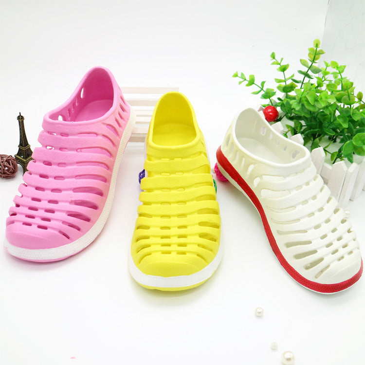 Three colorful shoes (pink, yellow, white) on a white background with green plants.