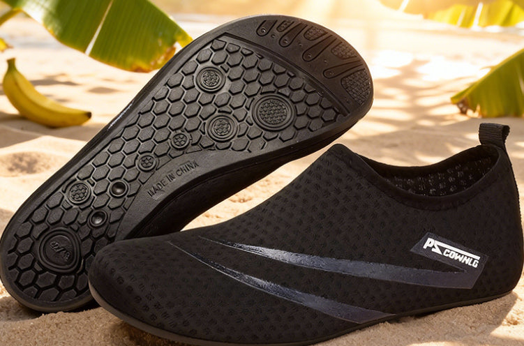 Black water shoes with a brand logo on a natural background