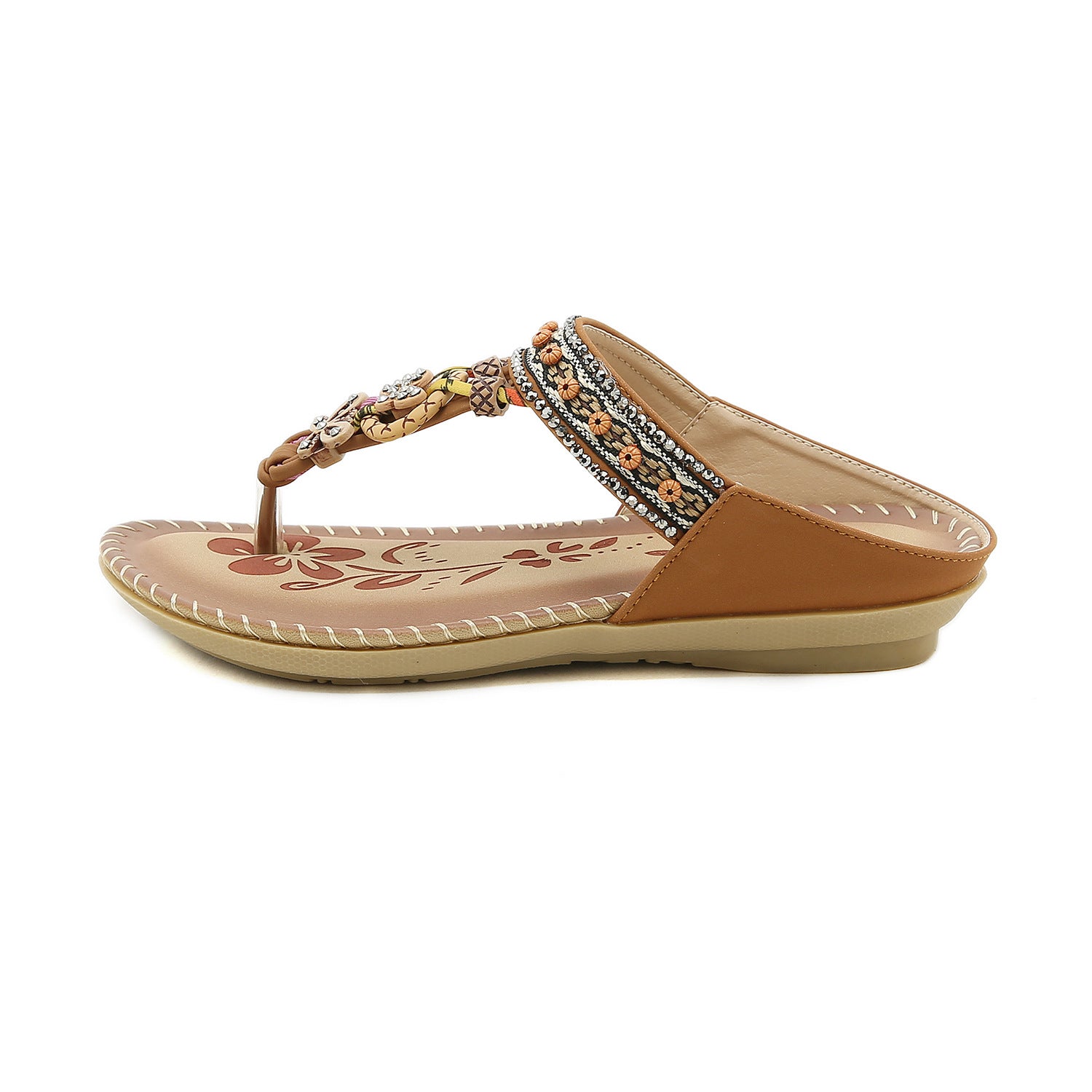 Tan sandal with decorative straps on a white background