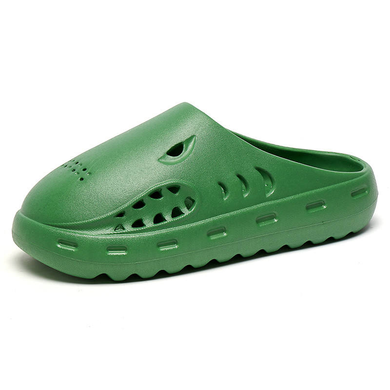 Green clog shoe on a white background