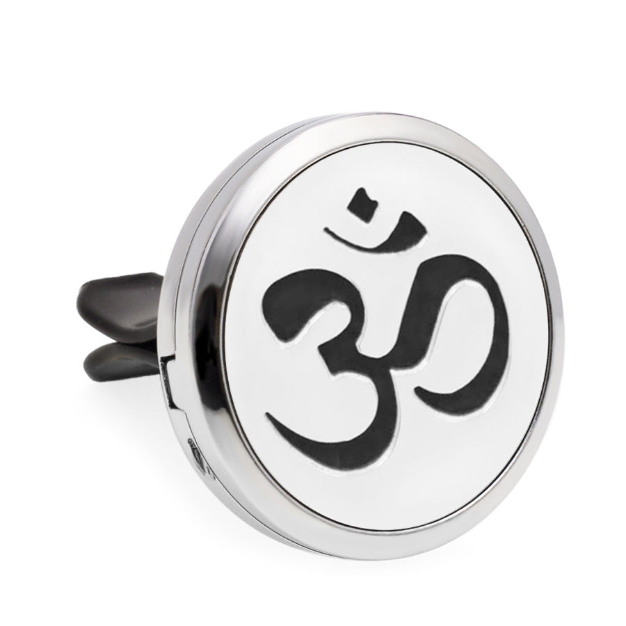 Round metallic diffuser with Om symbol on a white background