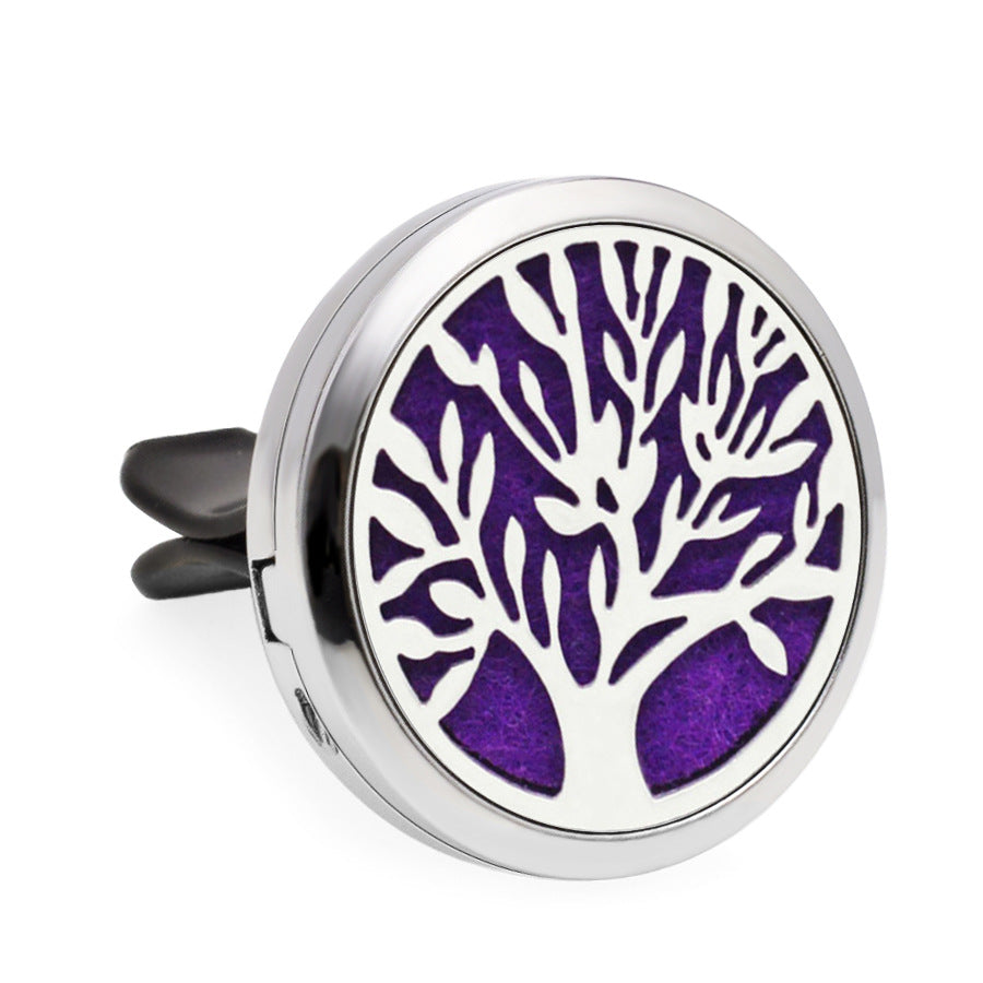 Round metallic diffuser with purple tree design on a white background