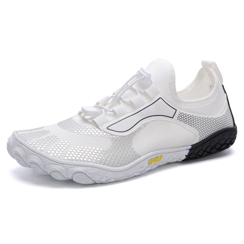 White athletic shoe with black sole on a white background