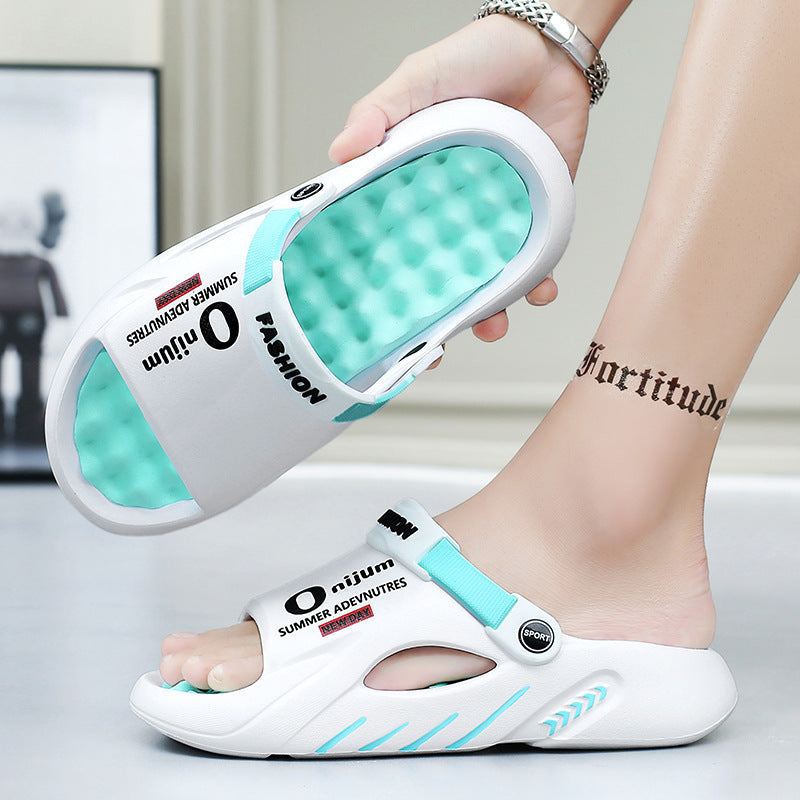 White sandals with blue accents held by a person, on a light background