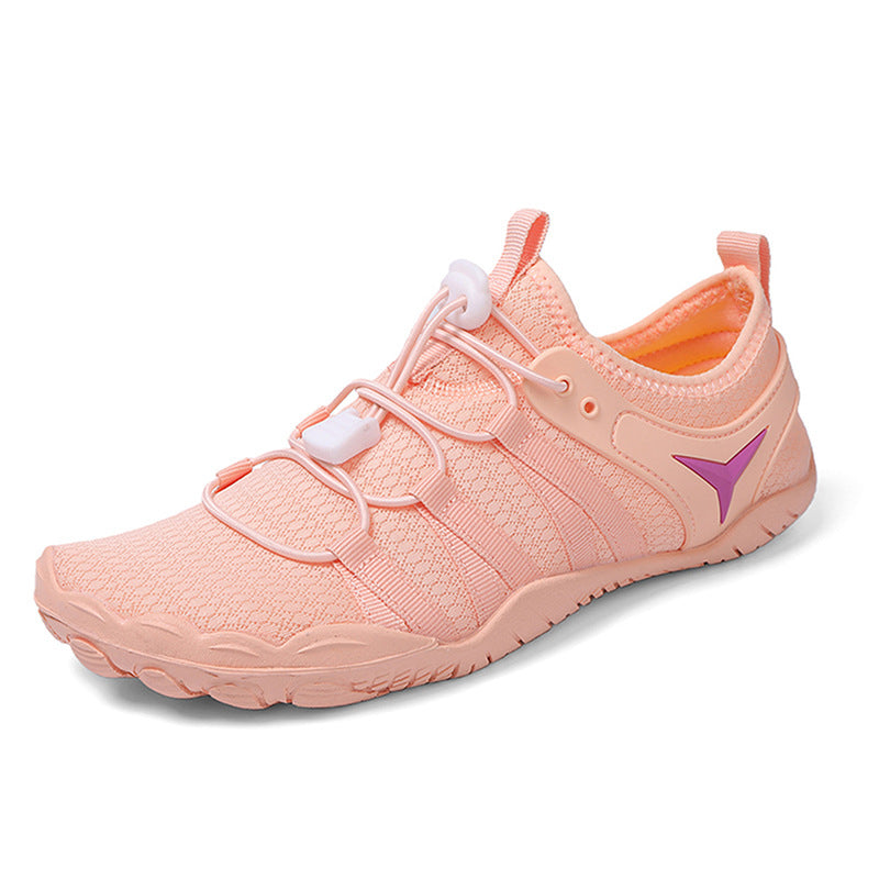Pink athletic shoe with a purple logo on a white background