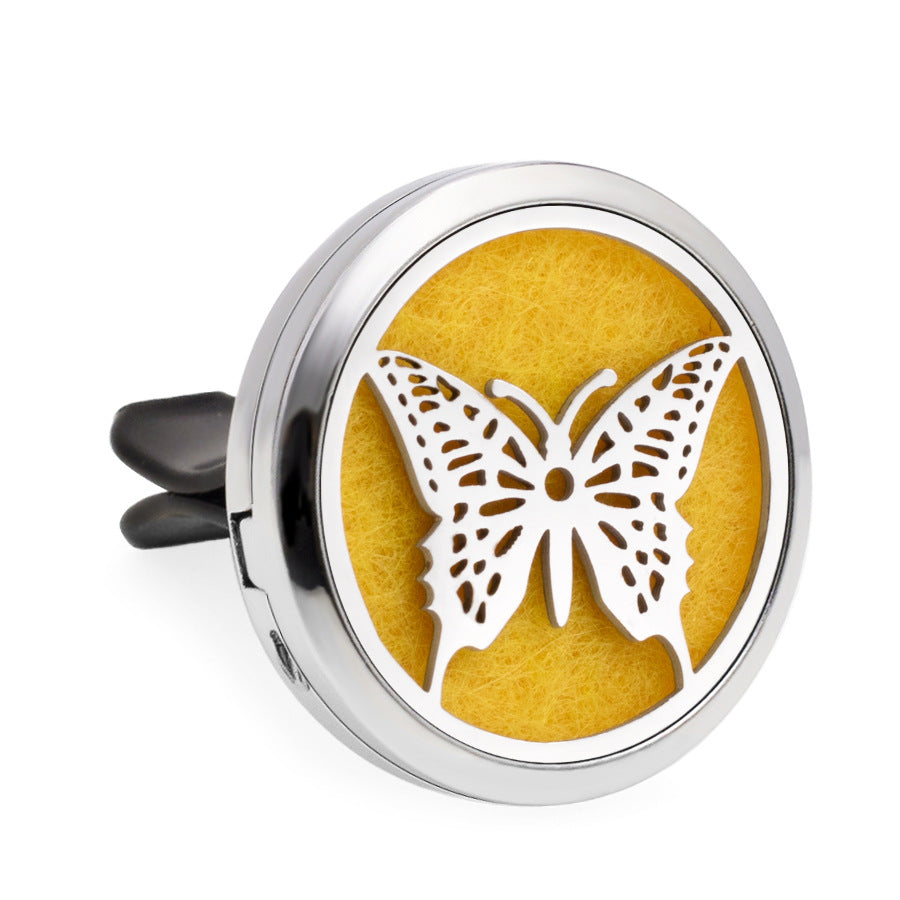Round air freshener with butterfly design on a yellow background