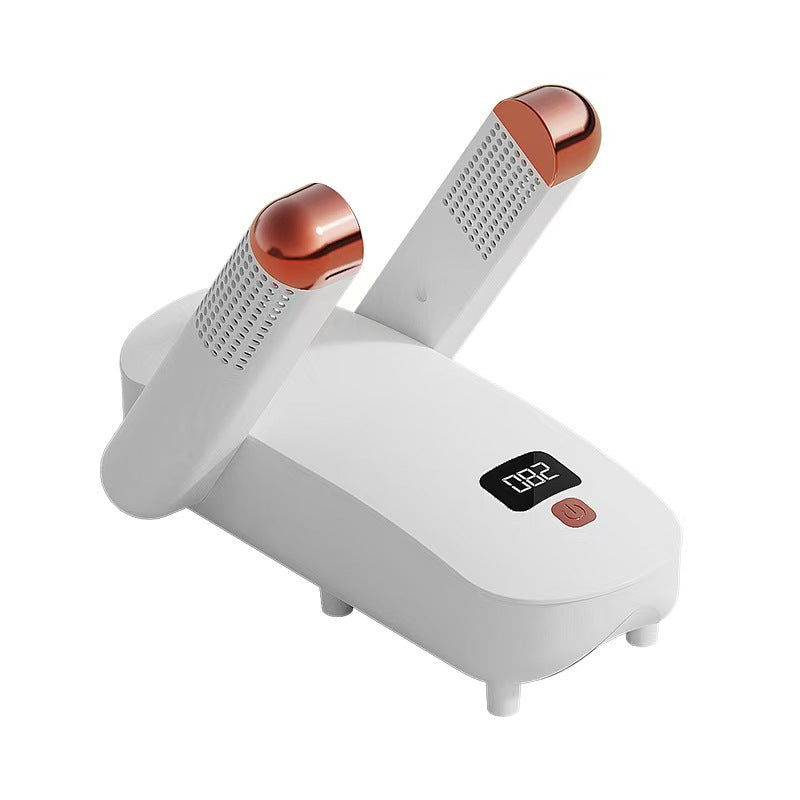 White and rose gold hair dryer on a white background