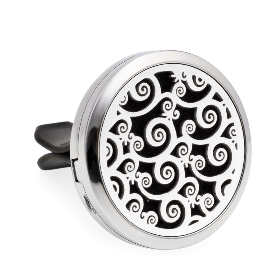 Round metallic diffuser with black spiral pattern on a white background