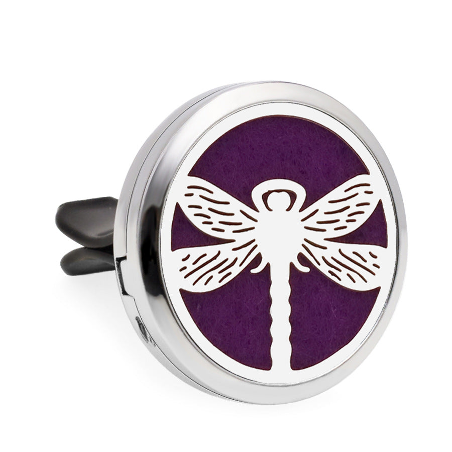 Round purple diffuser with white dragonfly design on a white background