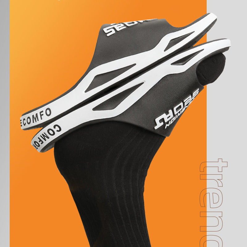 Black and white bicycle seat with 'Comfo' branding on an orange background
