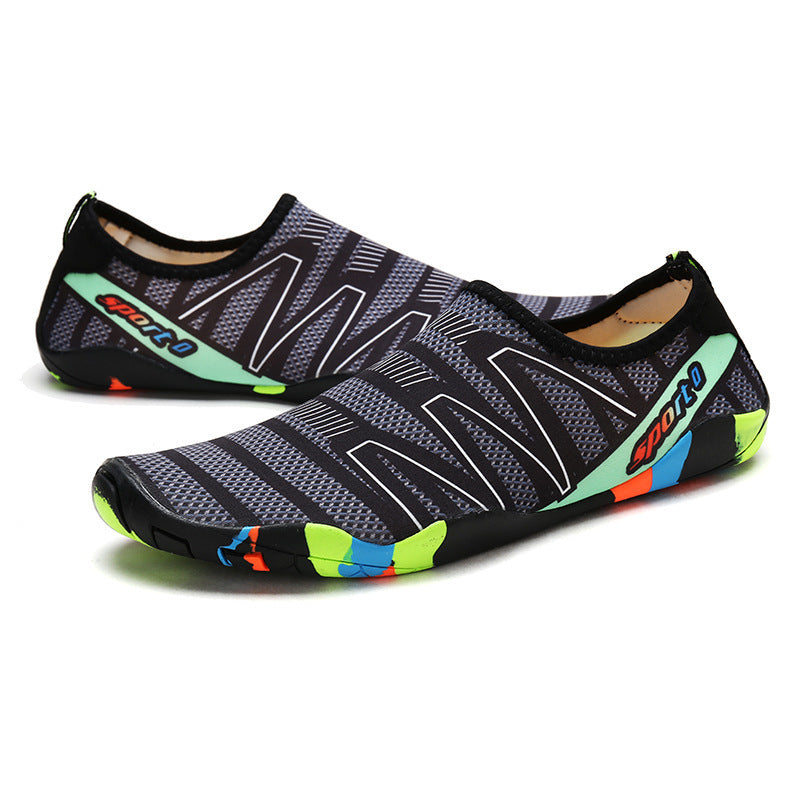 Pair of black water shoes with colorful accents on a white background