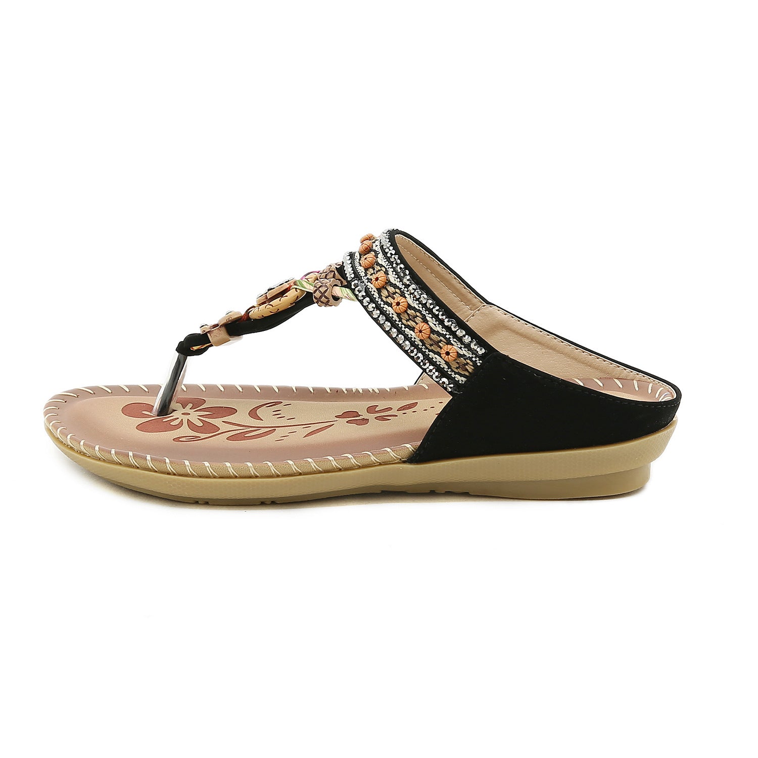 Black sandal with decorative straps on a white background