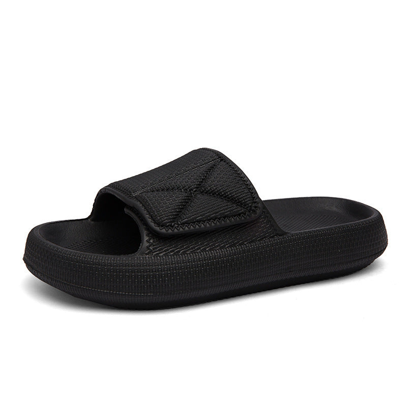 Black slide sandal on a white background